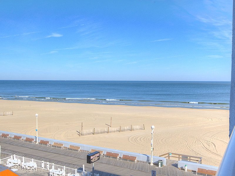 a view of the beach from an apartment balcony